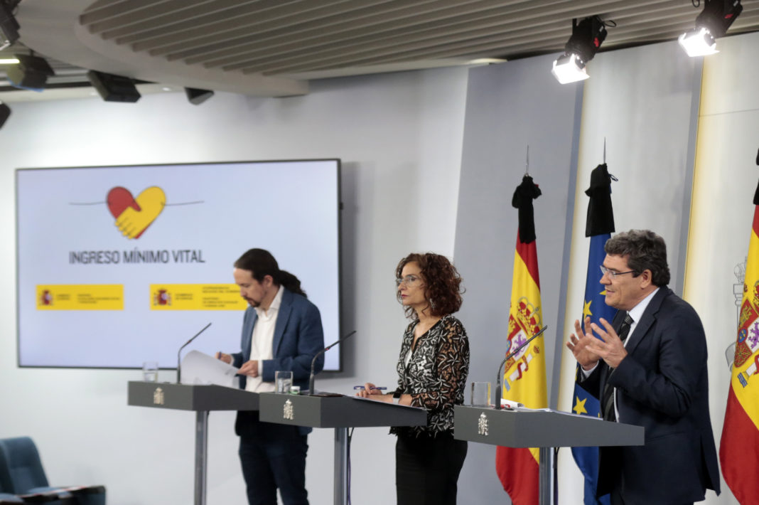 The Minister of Finance and government spokesperson, María Jesús Montero; the second vice president and minister of Social Rights and the 2030 Agenda, Pablo Iglesias, and the minister of Inclusion, Social Security and Migration, José Luis Escrivá, during the press conference after the Council of Ministers.