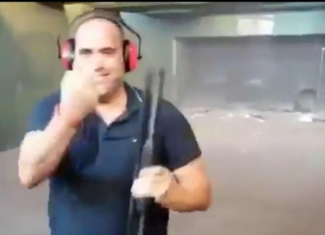 The shooter raising a single finger to the camera following the shootings