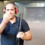 The shooter raising a single finger to the camera following the shootings