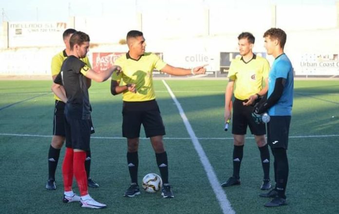 Racing San Miguel captain Gabriel (left) against CD Horadada.