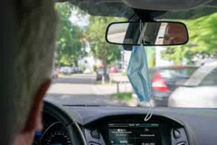 Fine for hanging mask on Rear view mirror.