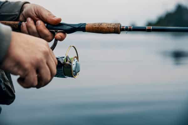 Summer fishing on the river in the early morning. Fishing background.