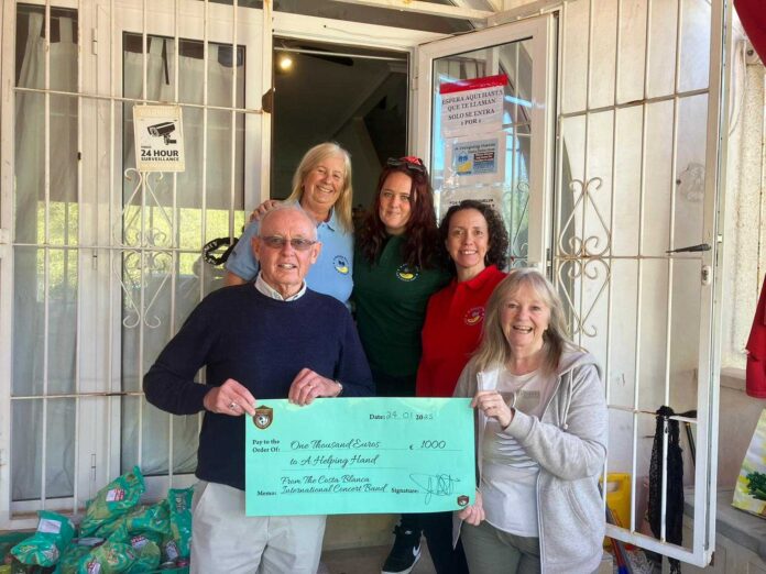 Volunteers from the charity are joined by Graham Robinson, Band Chairman, and Pat Shepley