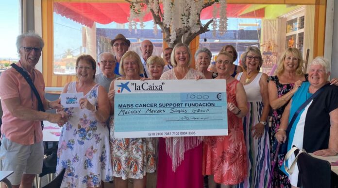 Melody Makers Singing Group Quesada met with Mike, a representative of the MABS cancer charity to present him with a cheque for €1000