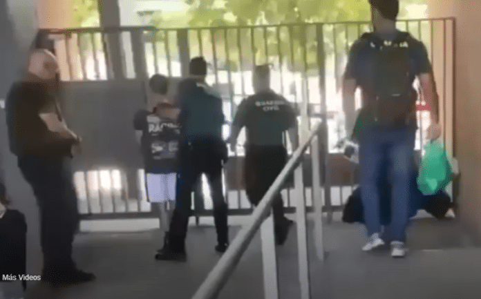 The individual, identified by the initials C.L.F., is accused of spreading hate speech and playing a leadership role in organizing online efforts to incite violence against migrant communities.